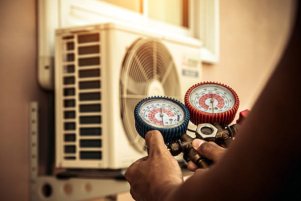Professional Air Conditioning Service technician working in Neville, OH